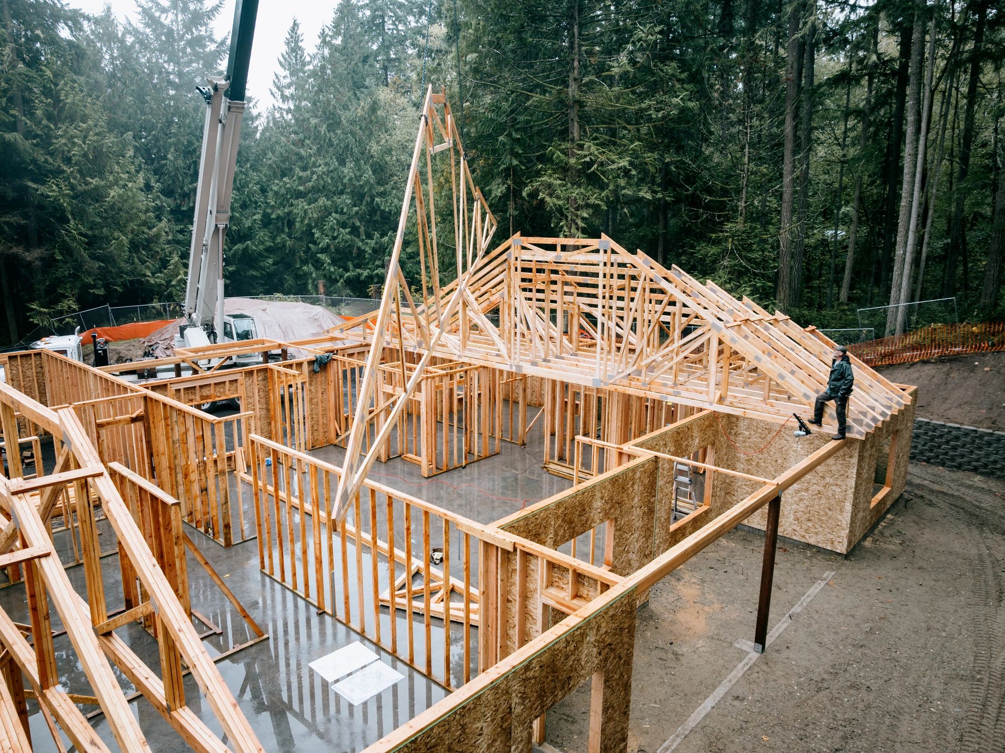 New home under construction with timber roof framing by Zerkle Construction in Southwest Missouri